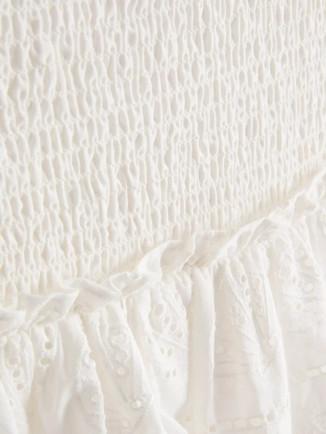 Mini-skjørt i bomull med lagvis design og broderi