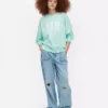 Oversized genser med «Miami»-skrift