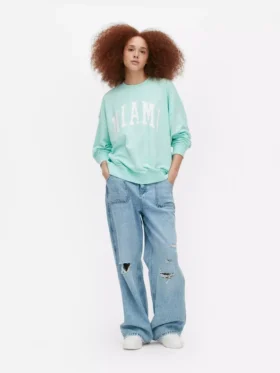 Oversized genser med «Miami»-skrift