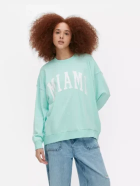 Oversized genser med «Miami»-skrift