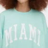 Oversized genser med «Miami»-skrift