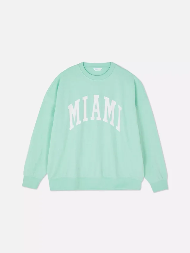 Oversized genser med «Miami»-skrift