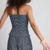 Paula Echevarría bandeau-top i gingham med volanger