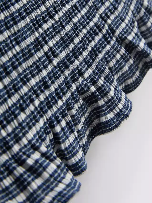Paula Echevarría bandeau-top i gingham med volanger