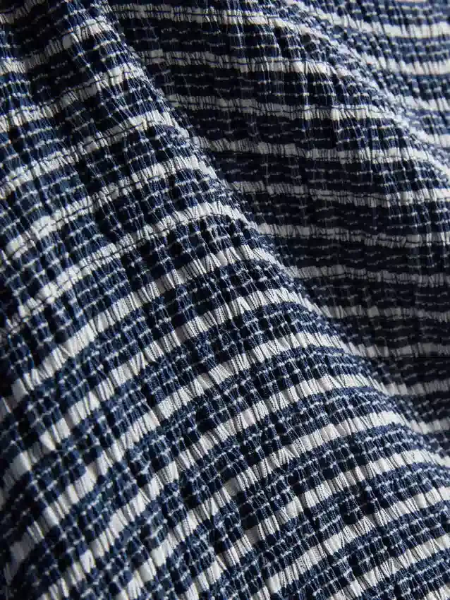 Paula Echevarría bandeau-top i gingham med volanger