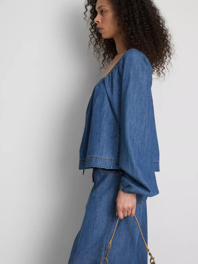 Paula Echevarría denim-top med puffermmer
