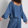 Paula Echevarría denim-top med puffermmer