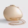 Paula Echevarría metallisk oval crossbody-veske
