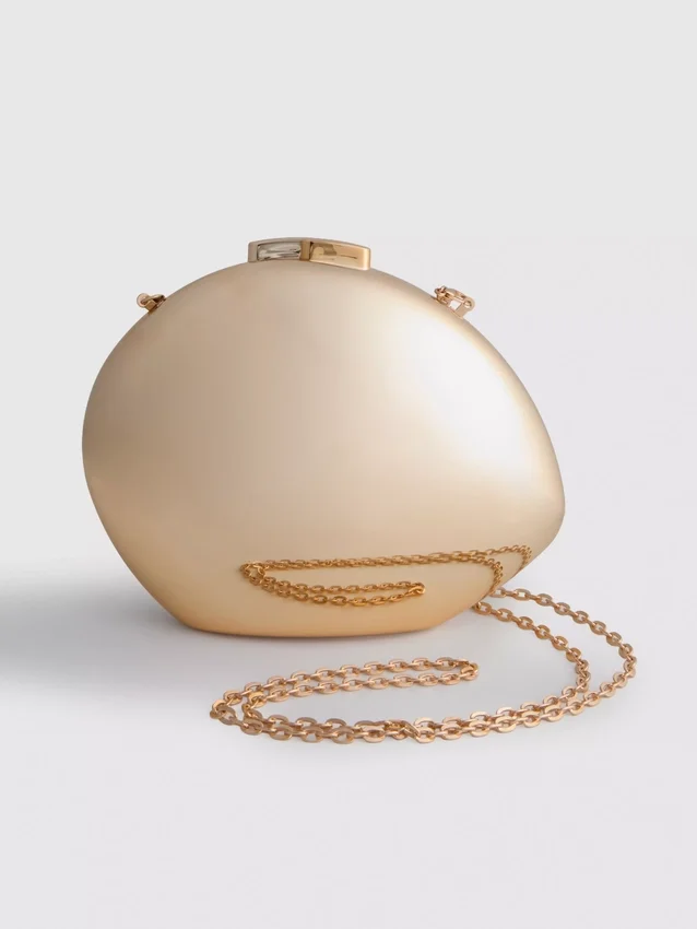 Paula Echevarría metallisk oval crossbody-veske