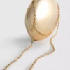 Paula Echevarría metallisk oval crossbody-veske