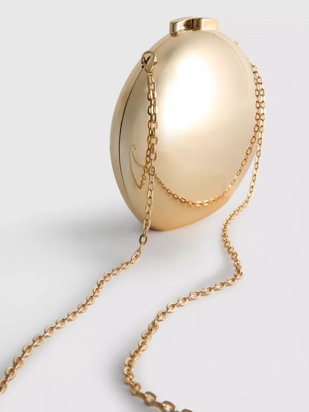 Paula Echevarría metallisk oval crossbody-veske