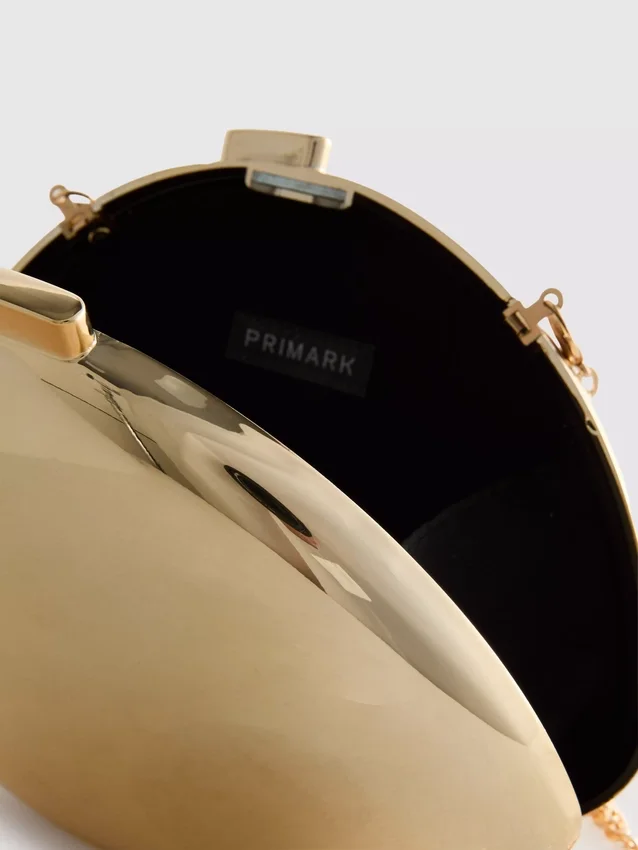 Paula Echevarría metallisk oval crossbody-veske