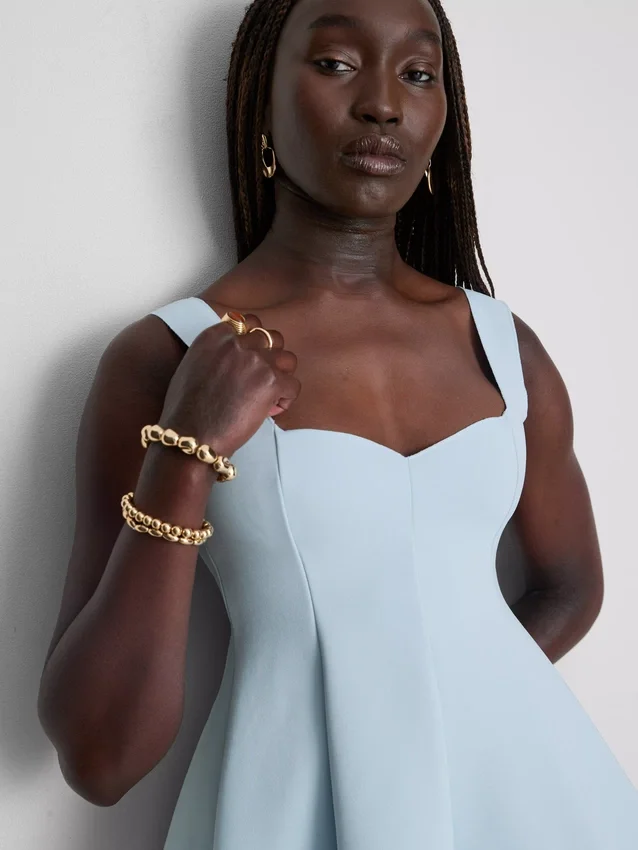 Peplum-top i krepp med hjerteformet utringning