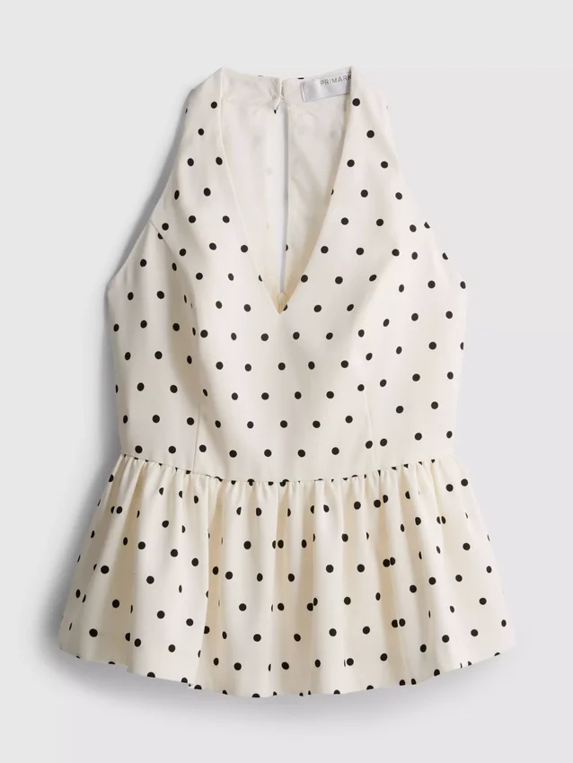 Peplum-top med halterneck og prikkemønster