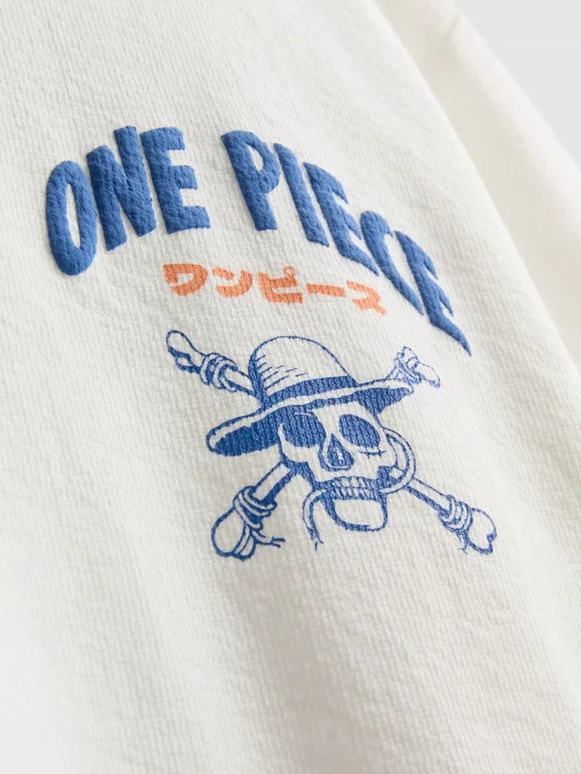 Sett med T-skjorte og shorts i ett stykke