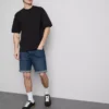 Slim-fit denimshorts med middels høy midje