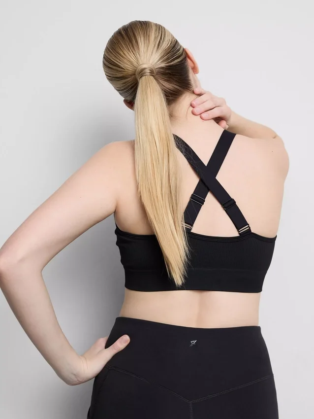 Sømløs aktiv crop-top med kryssrygg