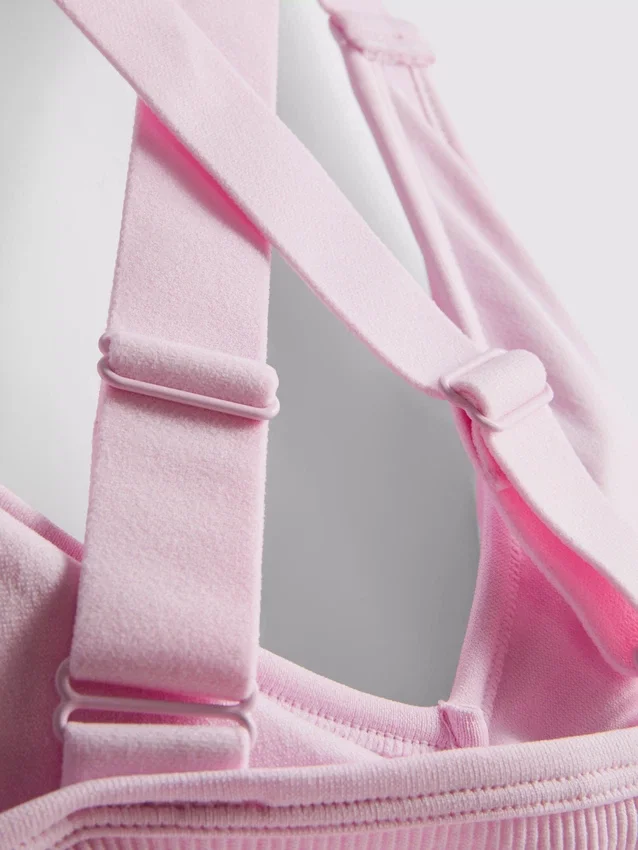 Sømløs aktiv crop-top med kryssrygg