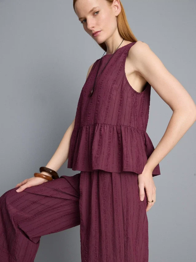 Stripet topp med peplum-kant