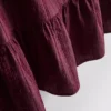 Stripet topp med peplum-kant