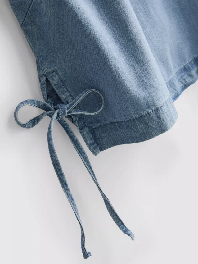 Tanktop i bomullsdenim med bånd i sidene