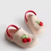 Tøfler med fruktmerke