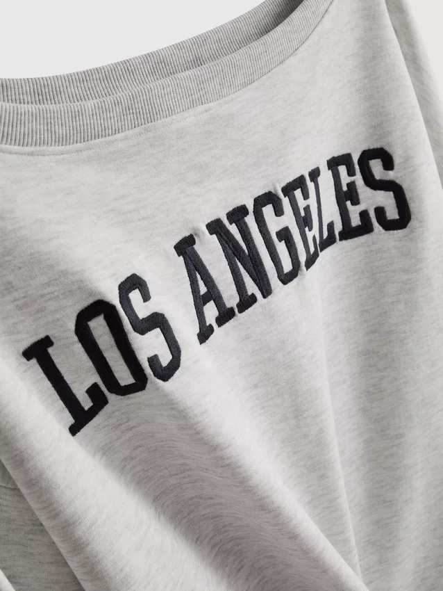 The Primark Scene | Sweatshirt med slagord og bare skuldre