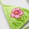 Triangel-bikinitopp med perleblomst