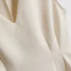 V-halset, peplum-inspirert, ermeløs topp