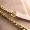 Vattert crossbody-veske med kjede